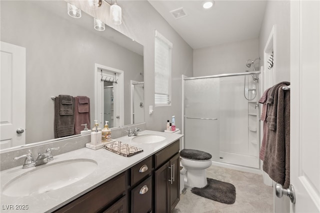 bathroom with toilet, walk in shower, and vanity