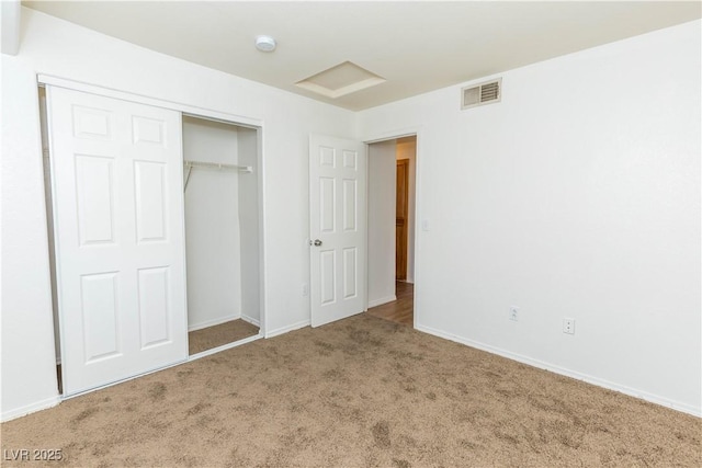 unfurnished bedroom featuring a closet and carpet