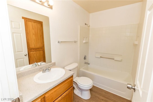 full bathroom with toilet, vanity, bathtub / shower combination, and hardwood / wood-style floors