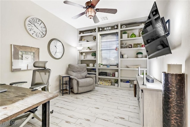 office featuring ceiling fan and light hardwood / wood-style flooring