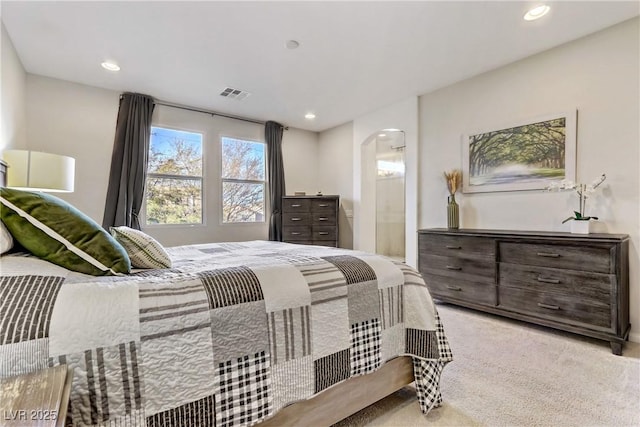 bedroom featuring light colored carpet