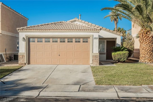 view of front of house featuring a front yard, a garage, and cooling unit