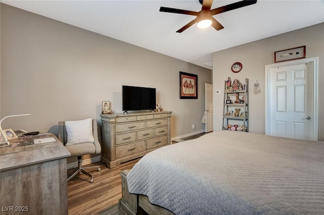 bedroom featuring hardwood / wood-style floors and ceiling fan