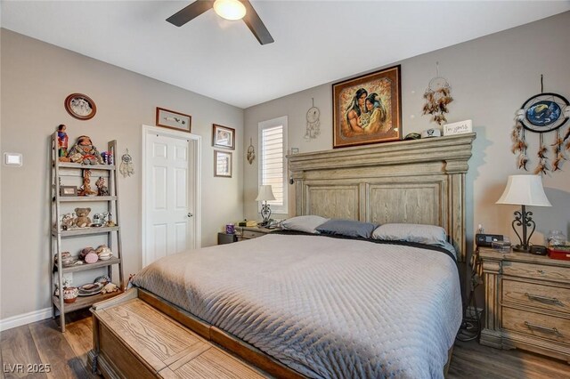 bedroom featuring dark hardwood / wood-style flooring and ceiling fan