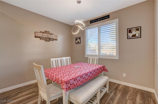 dining space with dark wood-type flooring