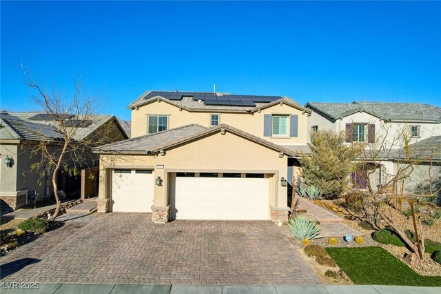 view of front facade with solar panels