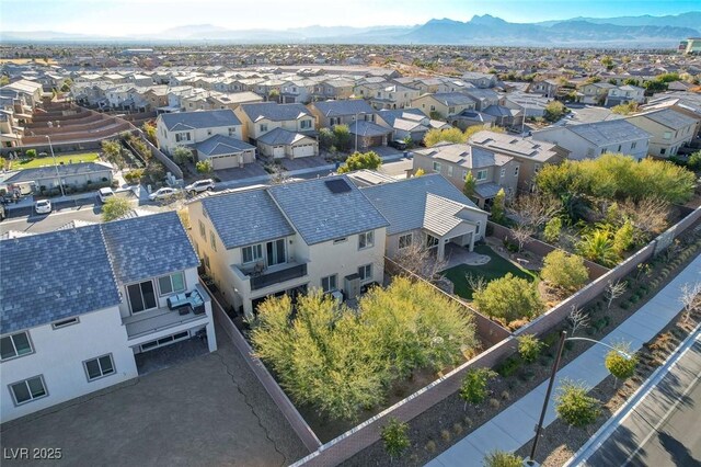 birds eye view of property with a mountain view