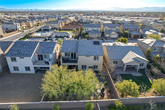 birds eye view of property with a mountain view