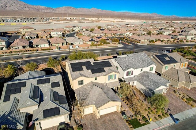 birds eye view of property featuring a mountain view