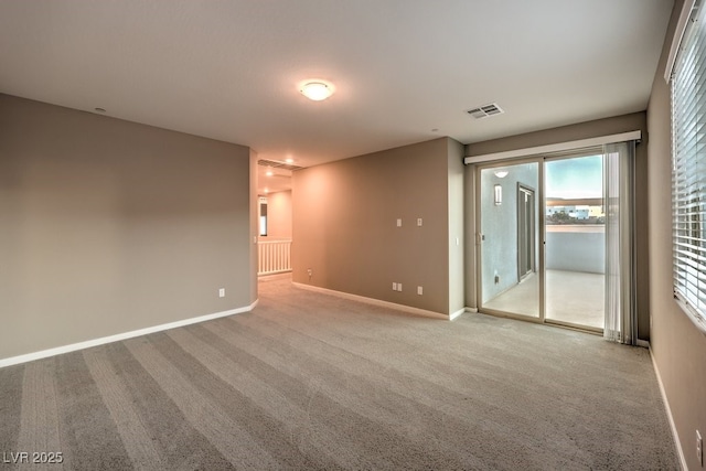 empty room with light colored carpet