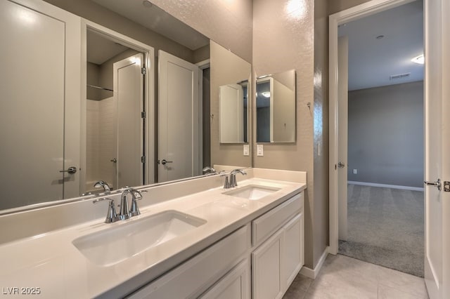 bathroom with shower / bathing tub combination, vanity, and tile patterned floors