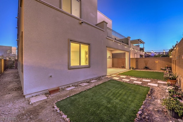 exterior space featuring a balcony and a patio area