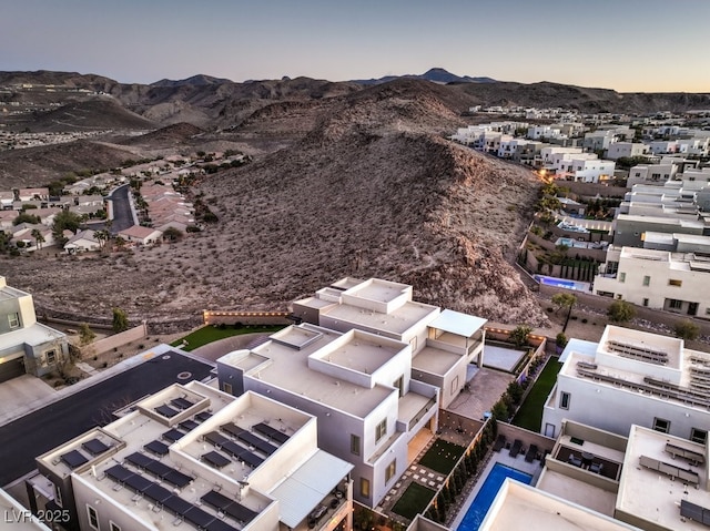 aerial view at dusk with a mountain view