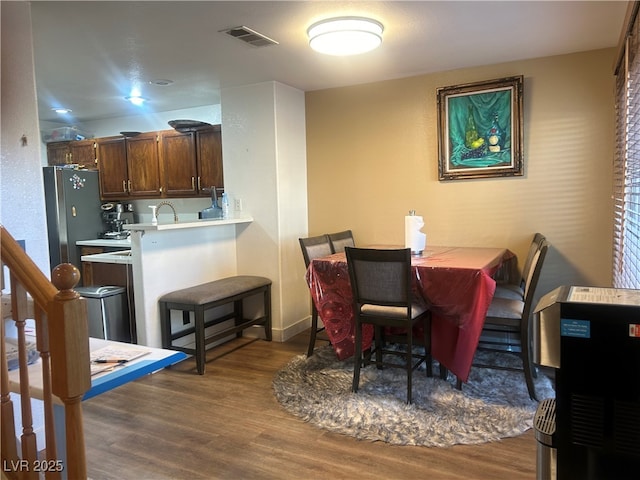 dining area featuring dark hardwood / wood-style floors