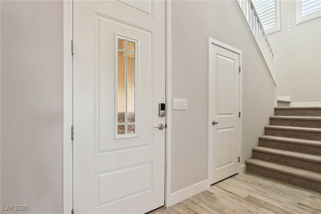 foyer entrance with light wood-type flooring