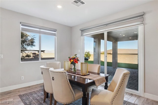 dining space with light wood-type flooring