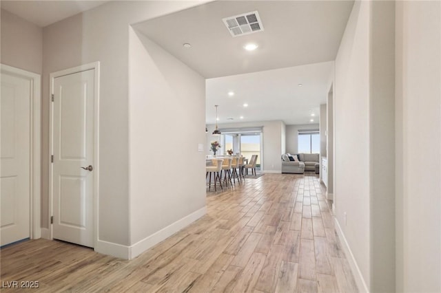 hall featuring light hardwood / wood-style floors