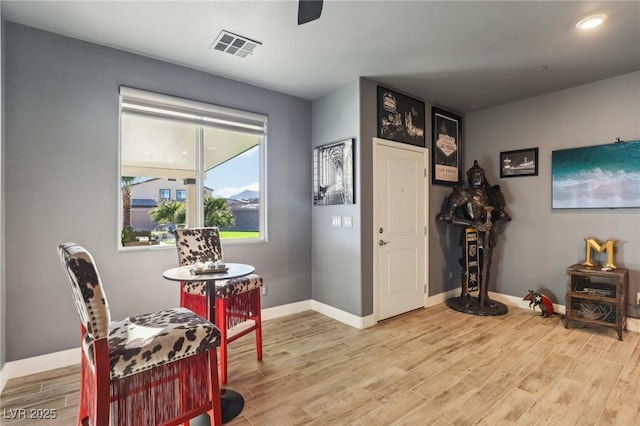 sitting room featuring light hardwood / wood-style floors