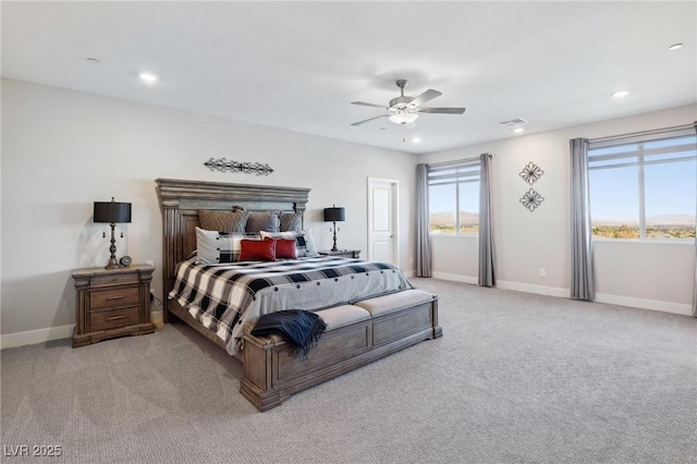 bedroom featuring light carpet and ceiling fan