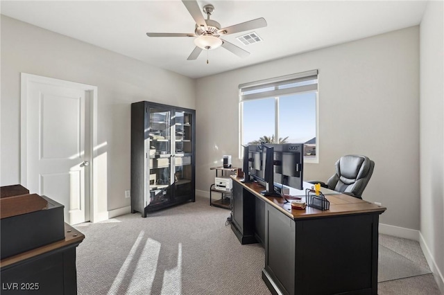 home office with ceiling fan and light colored carpet