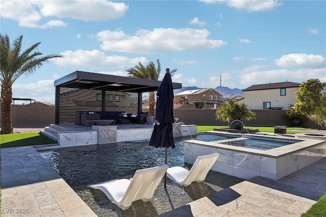 view of pool with pool water feature, an in ground hot tub, and a patio area