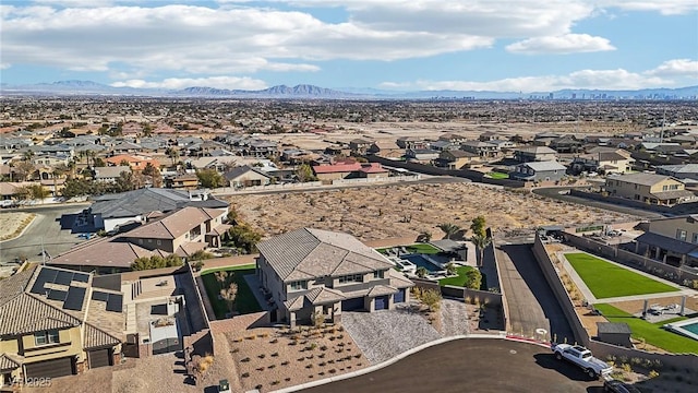 birds eye view of property with a mountain view