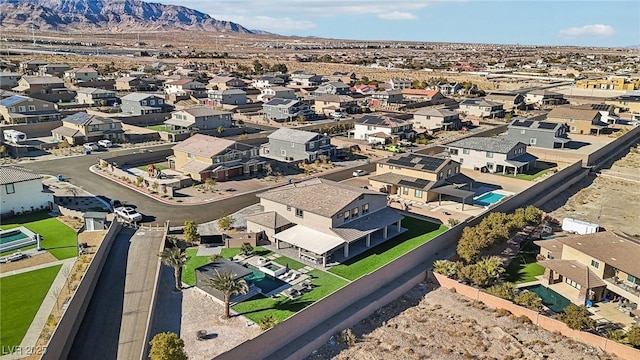 birds eye view of property featuring a mountain view