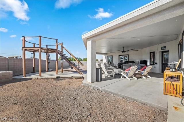 view of patio with ceiling fan and an outdoor hangout area