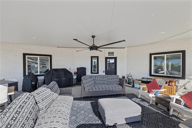 living room featuring ceiling fan