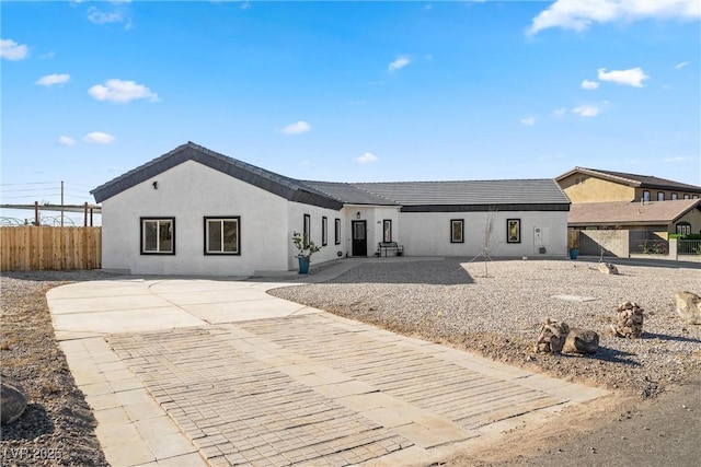 rear view of property featuring a patio area