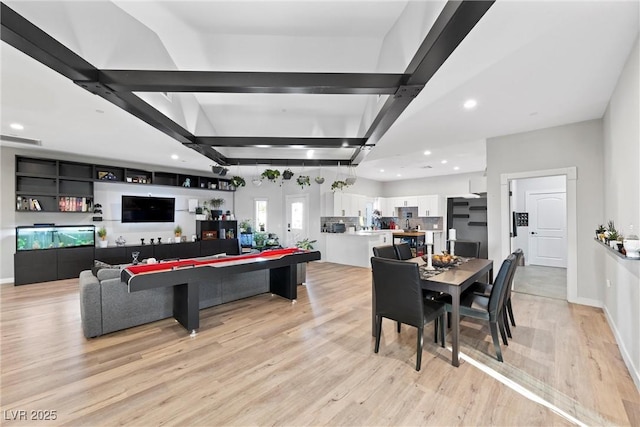 playroom with light hardwood / wood-style floors and beam ceiling