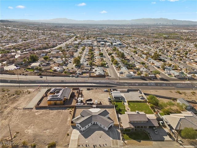 birds eye view of property featuring a mountain view