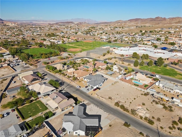 birds eye view of property featuring a mountain view