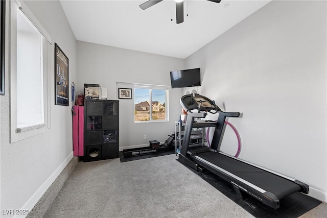 exercise area with ceiling fan and carpet flooring