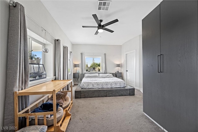 carpeted bedroom with ceiling fan