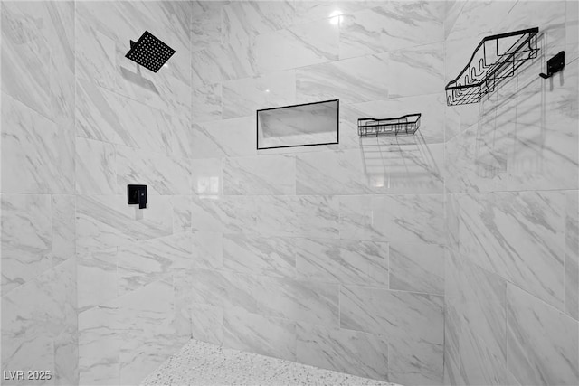 bathroom featuring tiled shower