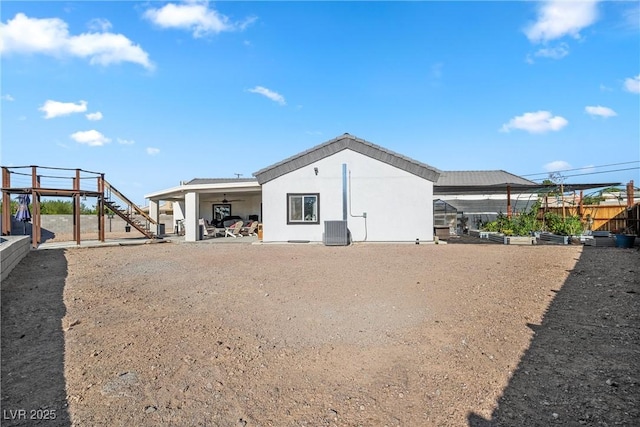 rear view of property with a patio and cooling unit