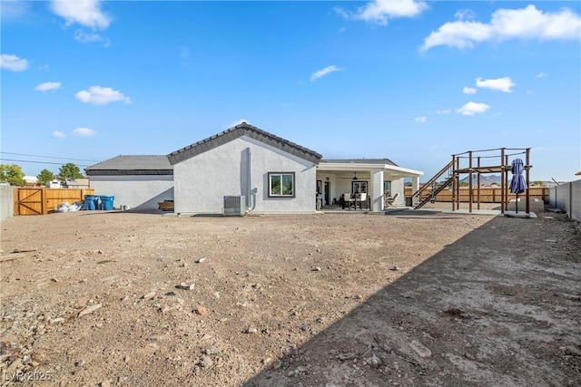 back of house featuring a patio and central air condition unit