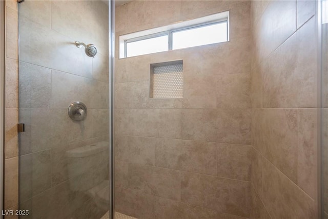 bathroom featuring tiled shower