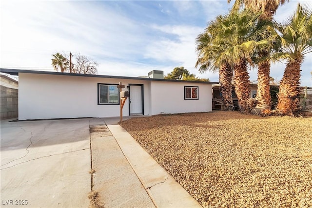 ranch-style home with a patio