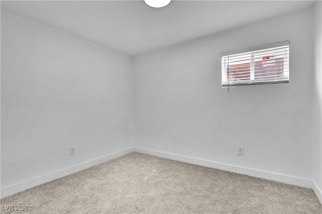 spare room with light colored carpet