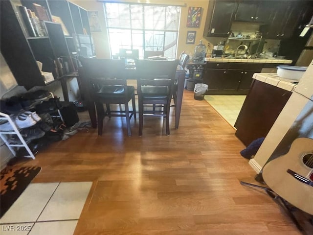 kitchen featuring tile countertops and light hardwood / wood-style flooring