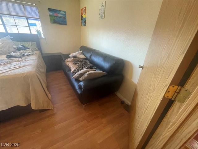 bedroom with hardwood / wood-style flooring