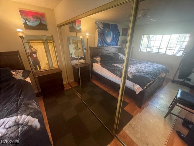 bedroom featuring ceiling fan and a closet