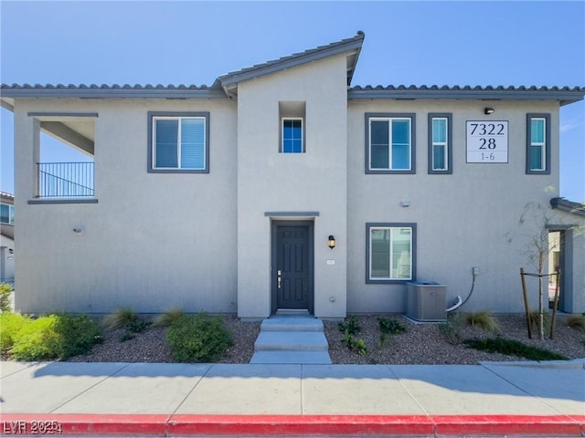 mediterranean / spanish-style home with central AC