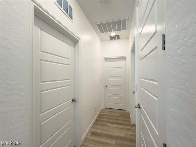 hall featuring light hardwood / wood-style flooring