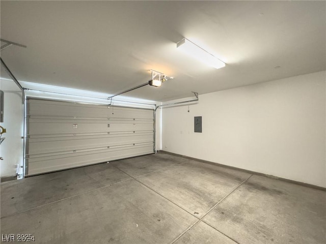 garage with a garage door opener and electric panel