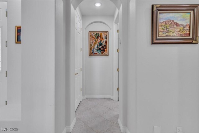 corridor with light tile patterned floors