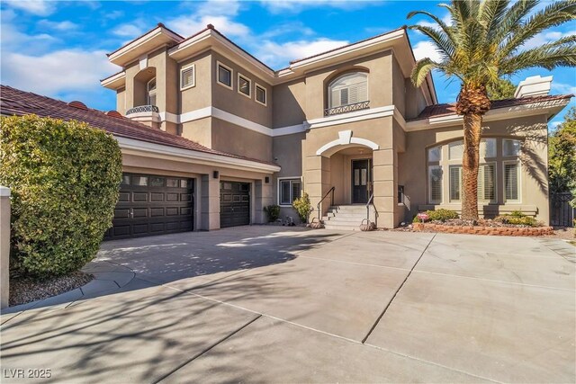 mediterranean / spanish house featuring a garage