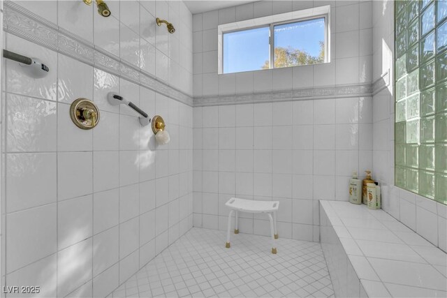 bathroom with tiled shower